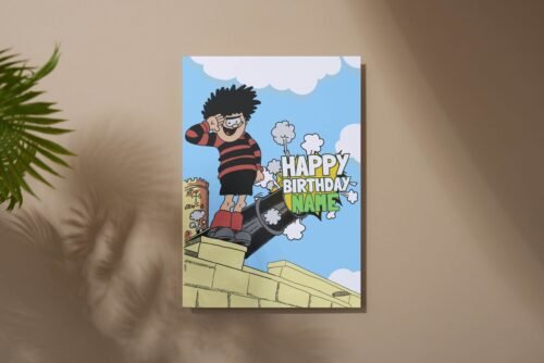Personalised Dennis menace cannon birthday card template with 'Happy Birthday' text and space for a name, ideal for custom celebrations.