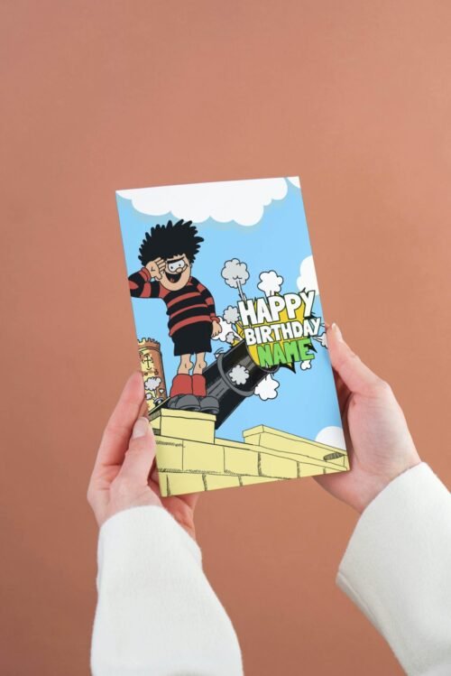 Personalised Dennis menace cannon birthday card template with 'Happy Birthday' text and space for a name, ideal for custom celebrations.