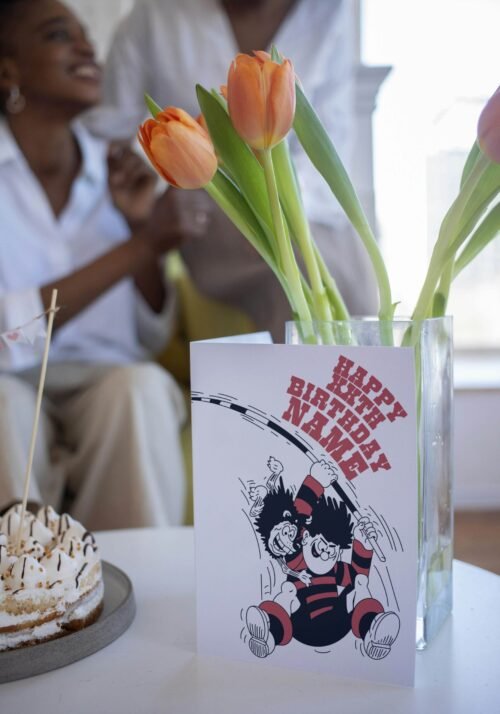 KA-POW! Personalise this Dennis & Gnasher Pole-vault Birthday card with names/ages for explosive Beano fun. Premium quality, ships fast – chaos guaranteed!
