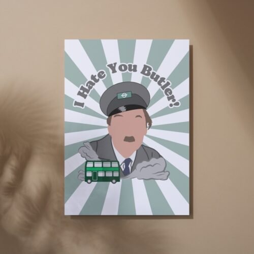 Screenshot of a customizable greeting card featuring the playful quote 'I hate you butler!' in bold, retro-style font, referencing the classic British sitcom On the Buses. The text is set against a plain or lightly textured background, evoking a humorous and nostalgic tone for fans of the show. This features the card upright on a table with a cartoon of character from the show Blake.