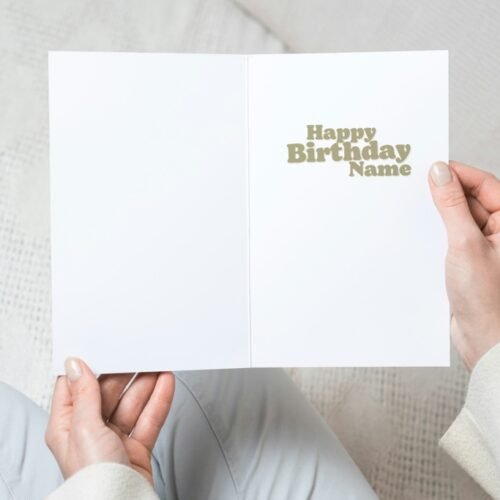 Close-up of the card in hand showing personalised name and age on the front