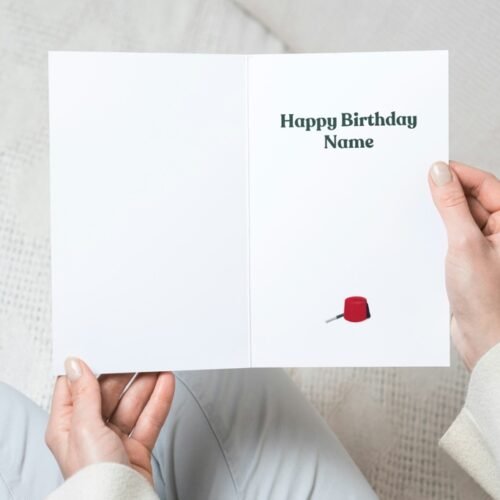 Person holding a Tommy Cooper birthday card with “Just like that!” quote and personalised name