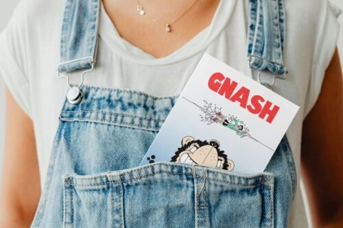 Parody comic birthday card peeking out of a denim pocket in a fun display