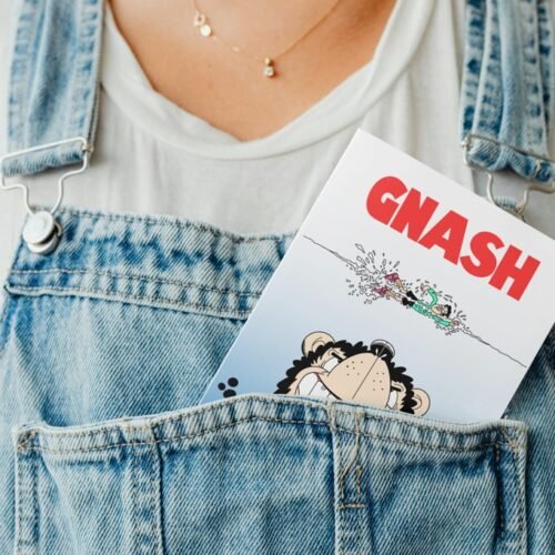 Parody comic birthday card peeking out of a denim pocket in a fun display