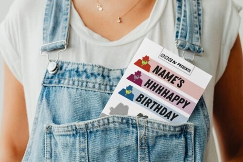 Tony Hancock birthday card peeking out of a denim dungaree pocket for a playful presentation
