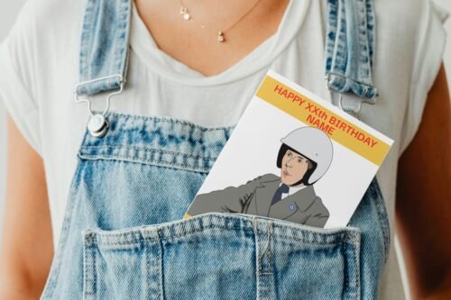 Frank Spencer birthday card peeking out of a denim dungaree pocket for a quirky display