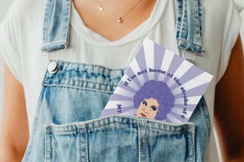 Humorous greeting card peeking from denim pocket, styled for product display