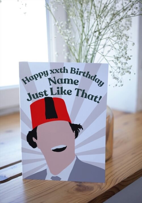 Retro British humour card resting on desk, perfect for fans of iconic one-liners
