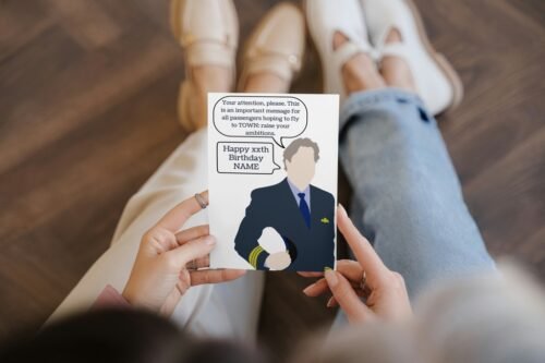 Close-up of hand holding the personalised Douglas card, showing custom name and age