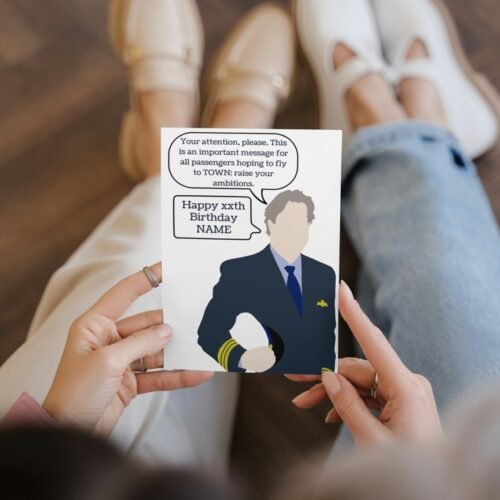 Close-up of hand holding the personalised Douglas card, showing custom name and age