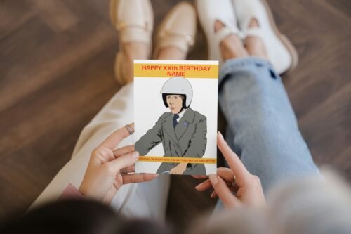 Close-up of a person holding the personalised Frank Spencer birthday card outdoors