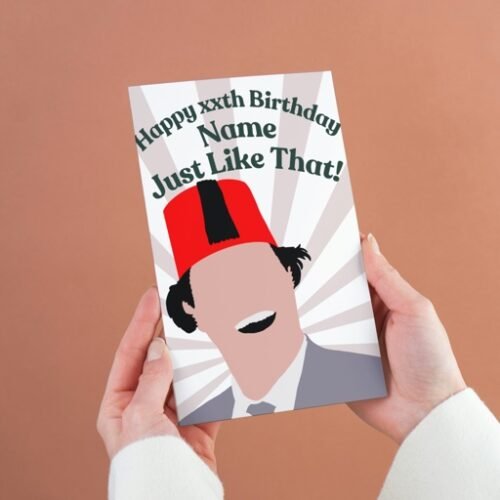 Person holding a Tommy Cooper birthday card with “Just like that!” quote and personalised name