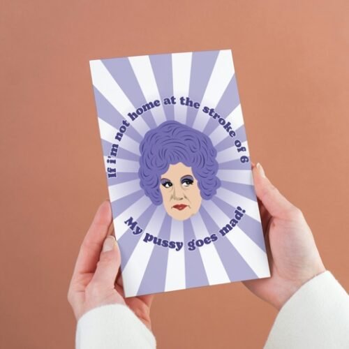 Mrs Slocombe Pussy Card being held, featuring “If I’m not home at the stroke of six” quote