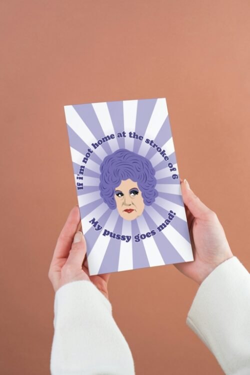 Mrs Slocombe Pussy Card being held, featuring “If I’m not home at the stroke of six” quote
