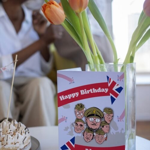 Cartoon-style vintage comedy card resting on a desk, ideal for fans of Dads Army
