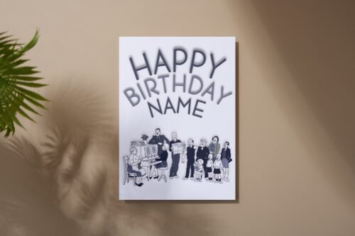 Flat lay of personalised The Broons birthday card on wooden table, showing front design clearly.