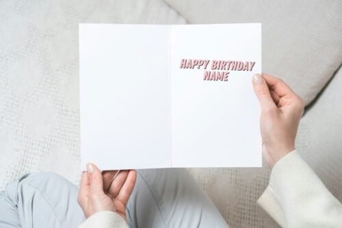 Funny birthday card held in hand, showing classic comic art and custom details
