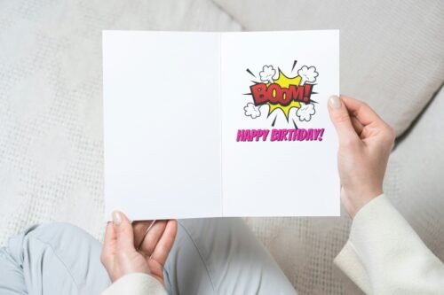 Funny comic card with retro Beano-inspired design held in hand