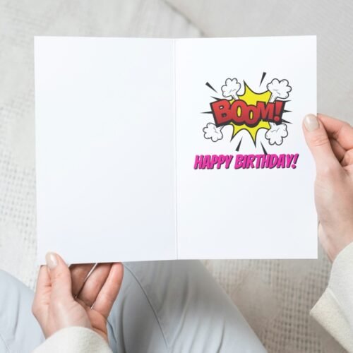 Funny comic card with retro Beano-inspired design held in hand