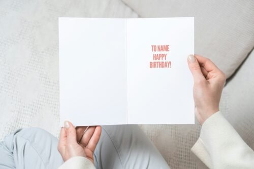 Vibrant Beano-inspired birthday card with matte finish held upright