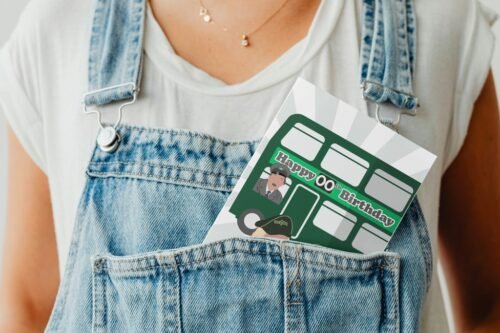 Funny retro birthday card peeking from a denim pocket, featuring On the Buses design