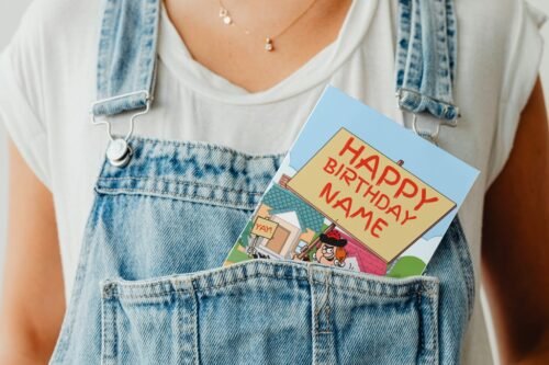 Minnie the Minx comic birthday card peeking from a denim pocket in playful display