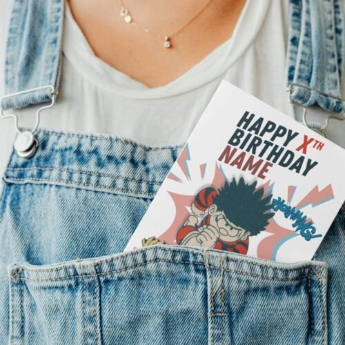 Personalised Dennis the Menace and Gnasher card peeking out from a denim pocket for fun display