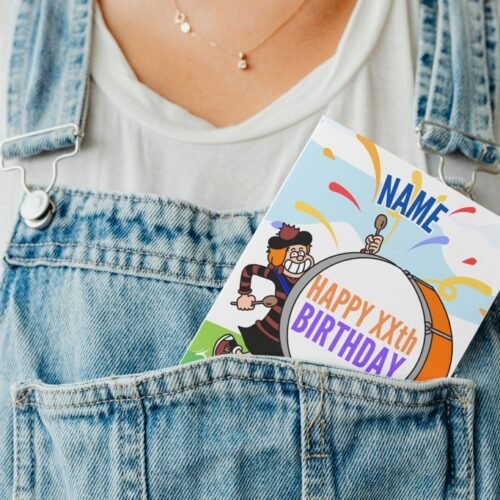 Personalised Beano-style birthday card peeking from denim pocket, adding playful touch