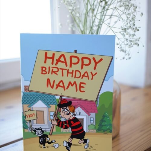 Minnie the Minx card on a table with colourful birthday placard design