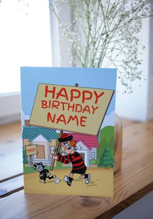Minnie the Minx card on a table with colourful birthday placard design
