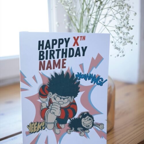 Beano-inspired birthday card with red, black and yellow comic styling on table display