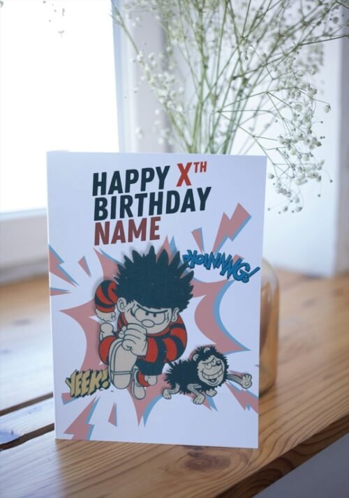 Beano-inspired birthday card with red, black and yellow comic styling on table display