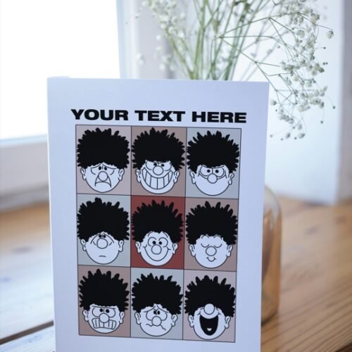 Open card on wooden surface with visible personalised insert