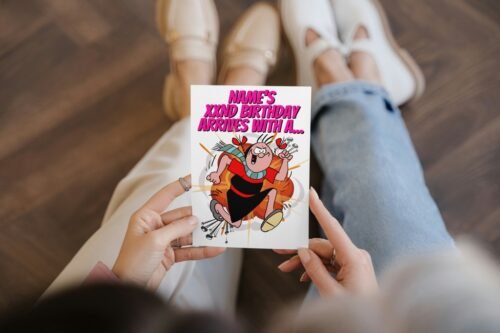 Funny comic card with retro Beano-inspired design held in hand
