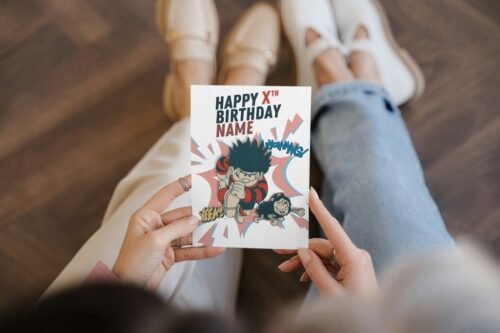 Comic birthday card featuring Dennis mid-action with explosive comic bursts and personalisation