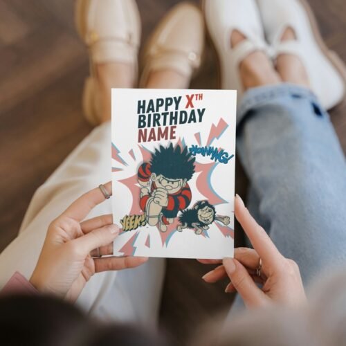 Comic birthday card featuring Dennis mid-action with explosive comic bursts and personalisation