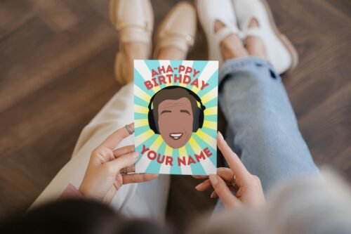 Premium birthday card held in hand with bold comedy design