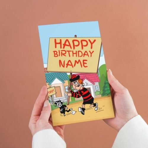Minnie the Minx personalised birthday card with custom placard message, held in hand