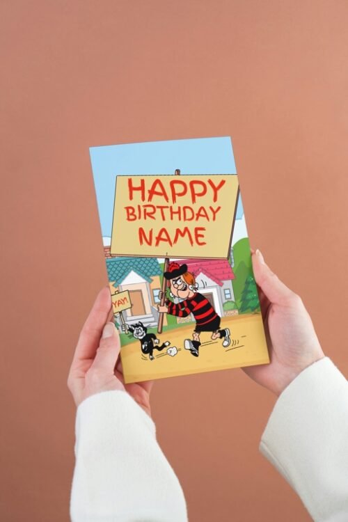 Minnie the Minx personalised birthday card with custom placard message, held in hand