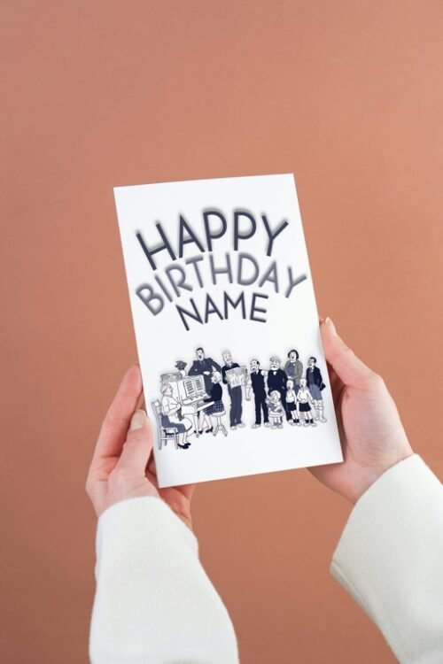 Hand holding personalised The Broons birthday card showing the full front design with family illustration and “Happy Birthday [Name]” text.