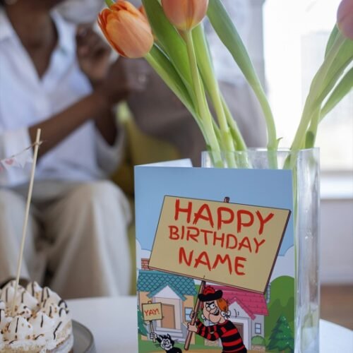 Comic birthday card featuring Minnie and her cat holding birthday signs